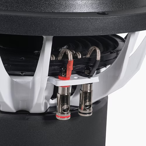 Close-up of a speaker cone with cable connectors on a white background