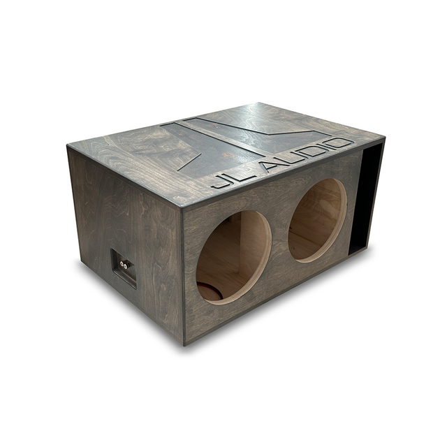 A JL Audio ported enclosure for dual 10-inch subwoofers, featuring a dark gray stained finish and branding on the front.