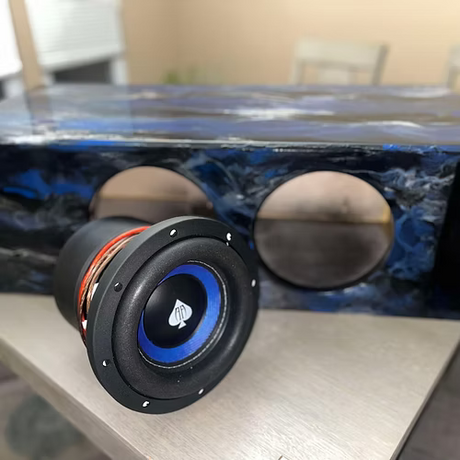 Speaker driver unit on a table with a blurred background