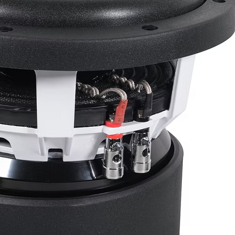 Close-up of a speaker's internal components with visible wiring and connectors.