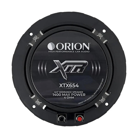 Angled rear-side view of the Orion XTX654 6.5" midrange speaker, capturing both the rear ferrite magnet assembly and part of the cone with its silver bullet phase plug. The image highlights the open basket design, rear cooling vents, and terminal connectors, giving a clear look at the speaker's power-handling and build features. Ideal for LibertyBassShop.com to show off the speaker's performance-ready construction.
